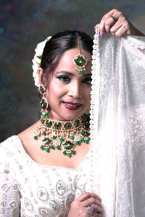 White Lehenga With Full Sleeves Blouse and Dupatta.