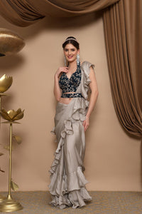 Grey Ruffle Saree, Designer saree, luxury saree, party wear saree, bridal saree, embroidered saree, silk saree, wedding saree, trendy saree, elegant saree, traditional saree, saree online, designer saree collection, fashion saree, festive saree, saree shopping, designer saree online, handcrafted saree, saree for women, saree with blouse, exclusive saree.