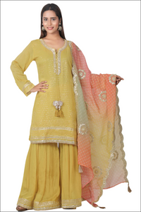 Gharara suit, designer gharara suits, bridal gharara suit, traditional gharara, gharara suit online, party wear gharara, Pakistani gharara suits, gharara dress, latest gharara designs, wedding gharara suit, embroidered gharara, heavy gharara suits, festive gharara, gharara suit for women, ethnic gharara.