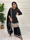 Gharara suit, designer gharara suits, bridal gharara suit, traditional gharara, gharara suit online, party wear gharara, Pakistani gharara suits, gharara dress, latest gharara designs, wedding gharara suit, embroidered gharara, heavy gharara suits, festive gharara, gharara suit for women, ethnic gharara.