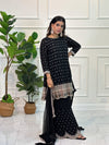 Gharara suit, designer gharara suits, bridal gharara suit, traditional gharara, gharara suit online, party wear gharara, Pakistani gharara suits, gharara dress, latest gharara designs, wedding gharara suit, embroidered gharara, heavy gharara suits, festive gharara, gharara suit for women, ethnic gharara.