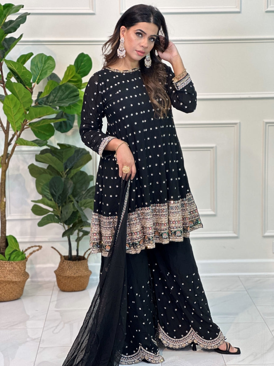 Gharara suit, designer gharara suits, bridal gharara suit, traditional gharara, gharara suit online, party wear gharara, Pakistani gharara suits, gharara dress, latest gharara designs, wedding gharara suit, embroidered gharara, heavy gharara suits, festive gharara, gharara suit for women, ethnic gharara.