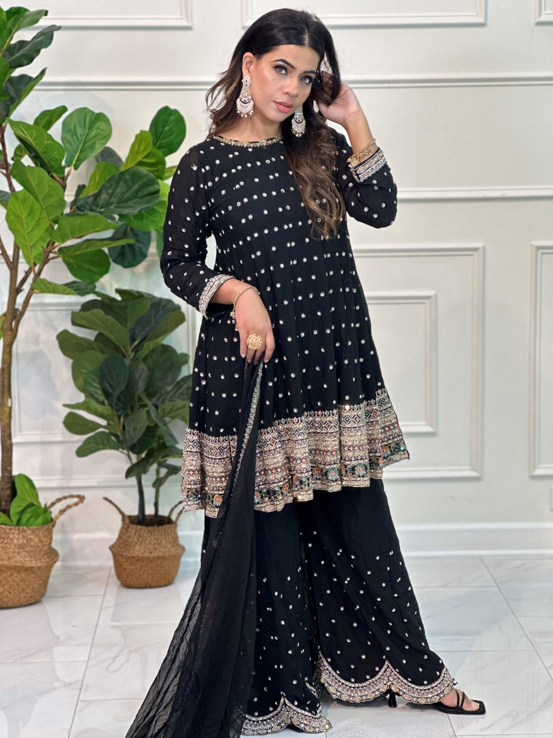 Gharara suit, designer gharara suits, bridal gharara suit, traditional gharara, gharara suit online, party wear gharara, Pakistani gharara suits, gharara dress, latest gharara designs, wedding gharara suit, embroidered gharara, heavy gharara suits, festive gharara, gharara suit for women, ethnic gharara.