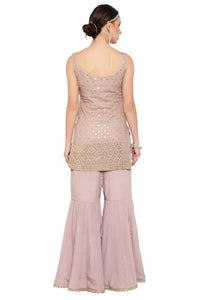 Gharara suit, designer gharara suits, bridal gharara suit, traditional gharara, gharara suit online, party wear gharara, Pakistani gharara suits, gharara dress, latest gharara designs, wedding gharara suit, embroidered gharara, heavy gharara suits, festive gharara, gharara suit for women, ethnic gharara.