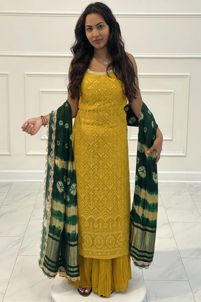 Gharara suit, designer gharara suits, bridal gharara suit, traditional gharara, gharara suit online, party wear gharara, Pakistani gharara suits, gharara dress, latest gharara designs, wedding gharara suit, embroidered gharara, heavy gharara suits, festive gharara, gharara suit for women, ethnic gharara.