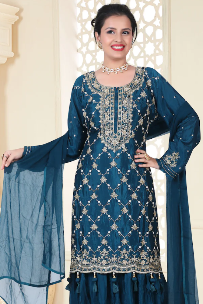 Gharara suit, designer gharara suits, bridal gharara suit, traditional gharara, gharara suit online, party wear gharara, Pakistani gharara suits, gharara dress, latest gharara designs, wedding gharara suit, embroidered gharara, heavy gharara suits, festive gharara, gharara suit for women, ethnic gharara.