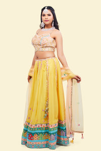 Yellow Lehenga with multicolor border and Pink Mirror Choli