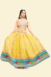 Yellow Lehenga with multicolor border and Pink Mirror Choli