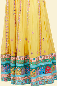 Yellow Lehenga with multicolor border and Pink Mirror Choli